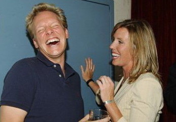 Jonathan Torrens laughing uproariously alongside semifamous blonde