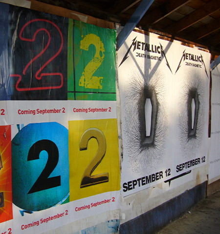 On construction hoarding: CBC Radio 2 relaunch posters alongside Metallica poster