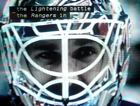 Caption includes the italicized word Lightening over an image of a goalie