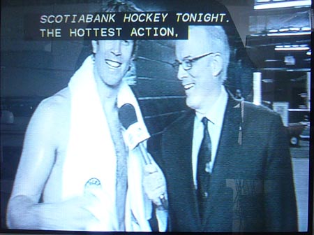 Joe Thornton wears only a towel as he’s interviewed. Caption: SCOTIABANK HOCKEY TONIGHT. THE HOTTEST ACTION