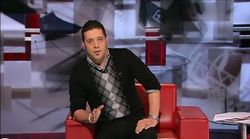 Strombo in black sweaterh with grey diamonds in a centre stripe