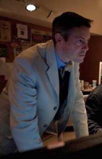 David Michael Lamb in shirt, tie, white jacket